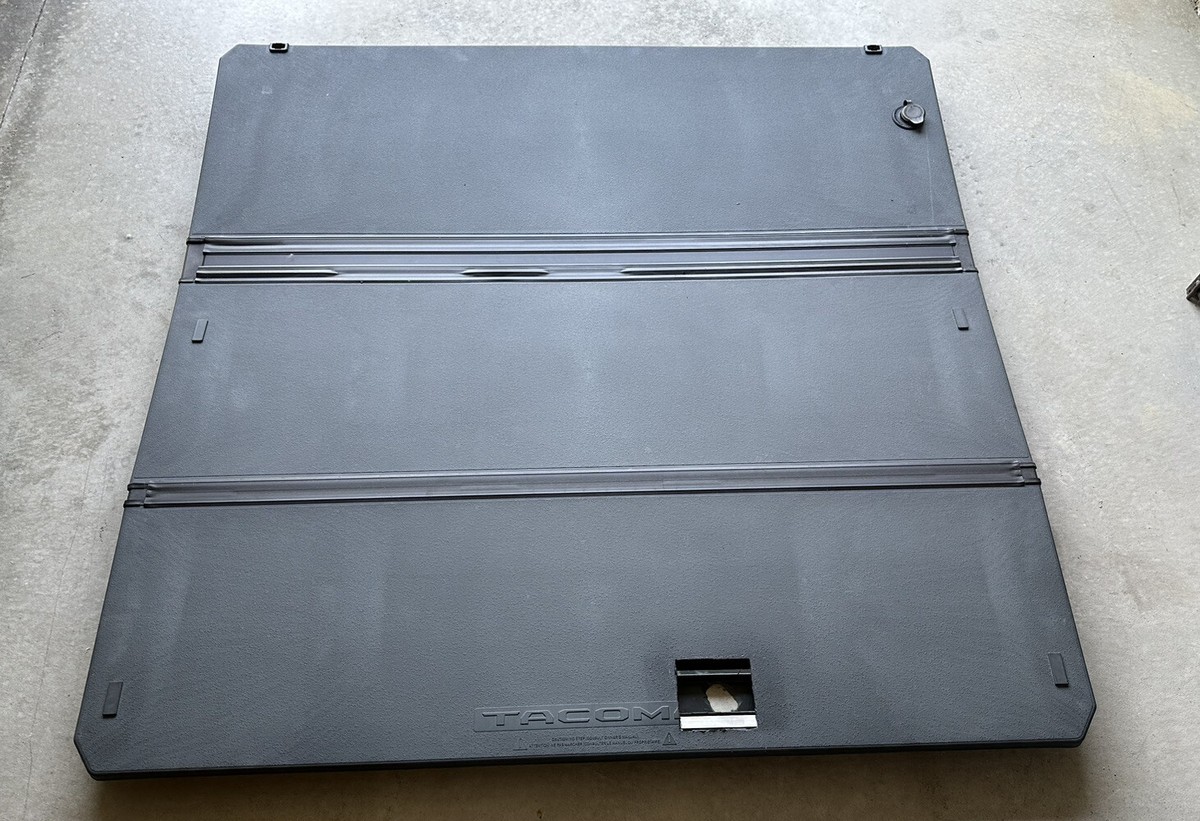 Toyota Tacoma tri-fold tonneau cover for sale installed on pickup truck bed