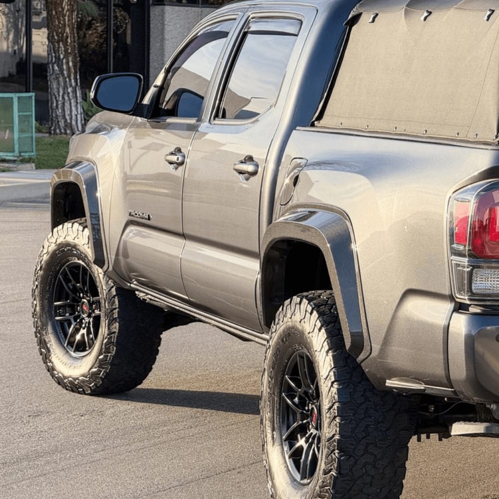 Toyota Tacoma front and rear fender flares, Toyota Tacoma OEM-style front fender flare, Toyota Tacoma rear fender flare replacement, Toyota Tacoma pocket-style fender flares, Toyota Tacoma bolt-on fender flares, Toyota Tacoma smooth black fender flares, Toyota Tacoma textured black front and rear fender flares, Toyota Tacoma off-road fender flare kit, Toyota Tacoma replacement front passenger-side fender flare, Toyota Tacoma replacement rear driver-side fender flare, Toyota Tacoma front and rear fender flare set, Aftermarket Toyota Tacoma fender flares for off-road trucks, Toyota Tacoma front and rear fender flare set for replacement and off-road styling,