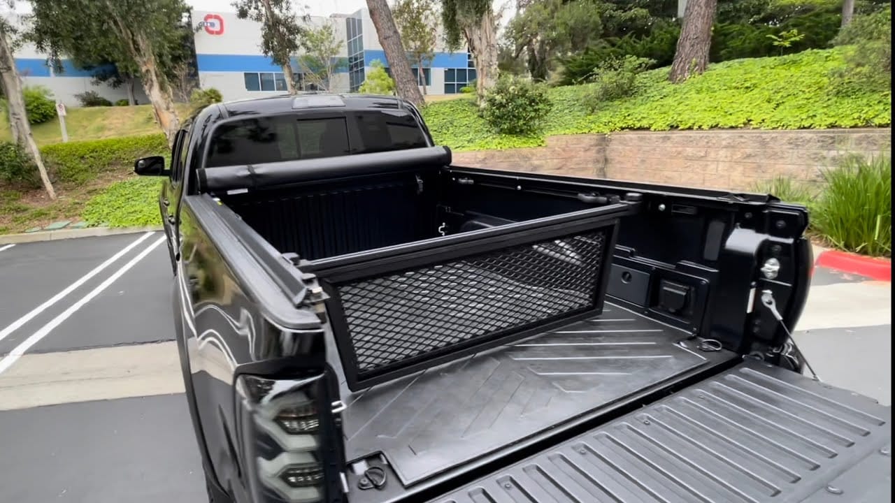Toyota Tacoma cargo management system with bed divider and Molle storage panels