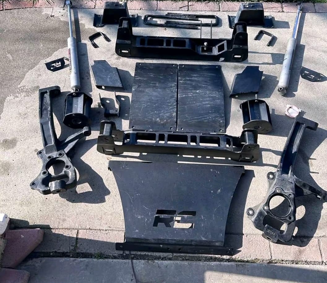 GMC Sierra 1500 suspension lift kit with shocks and front suspension components, GMC Sierra 1500 2 inch suspension leveling lift kit, GMC Sierra 1500 3 inch suspension lift kit with upgraded shocks, GMC Sierra 1500 4 inch suspension lift kit with control arms and shocks, GMC Sierra 1500 6 inch suspension lift kit for off-road applications, GMC Sierra 2500HD heavy duty suspension lift kit with shocks, GMC Sierra 3500HD suspension lift kit with heavy duty components, GMC Sierra suspension lift kit with coilovers and performance shocks, GMC Sierra pickup truck suspension lift kit with front and rear components, GMC Sierra 1500 complete suspension lift kit for larger tires, GMC Sierra 2500HD 6 inch suspension lift kit with upgraded control arms, GMC Sierra off-road suspension lift kit with shocks and springs, GMC Sierra suspension lift kit components displayed for installation, Complete GMC Sierra suspension lift kit with shocks, springs, and control arms, GMC Sierra pickup suspension lift system for increased ground clearance,