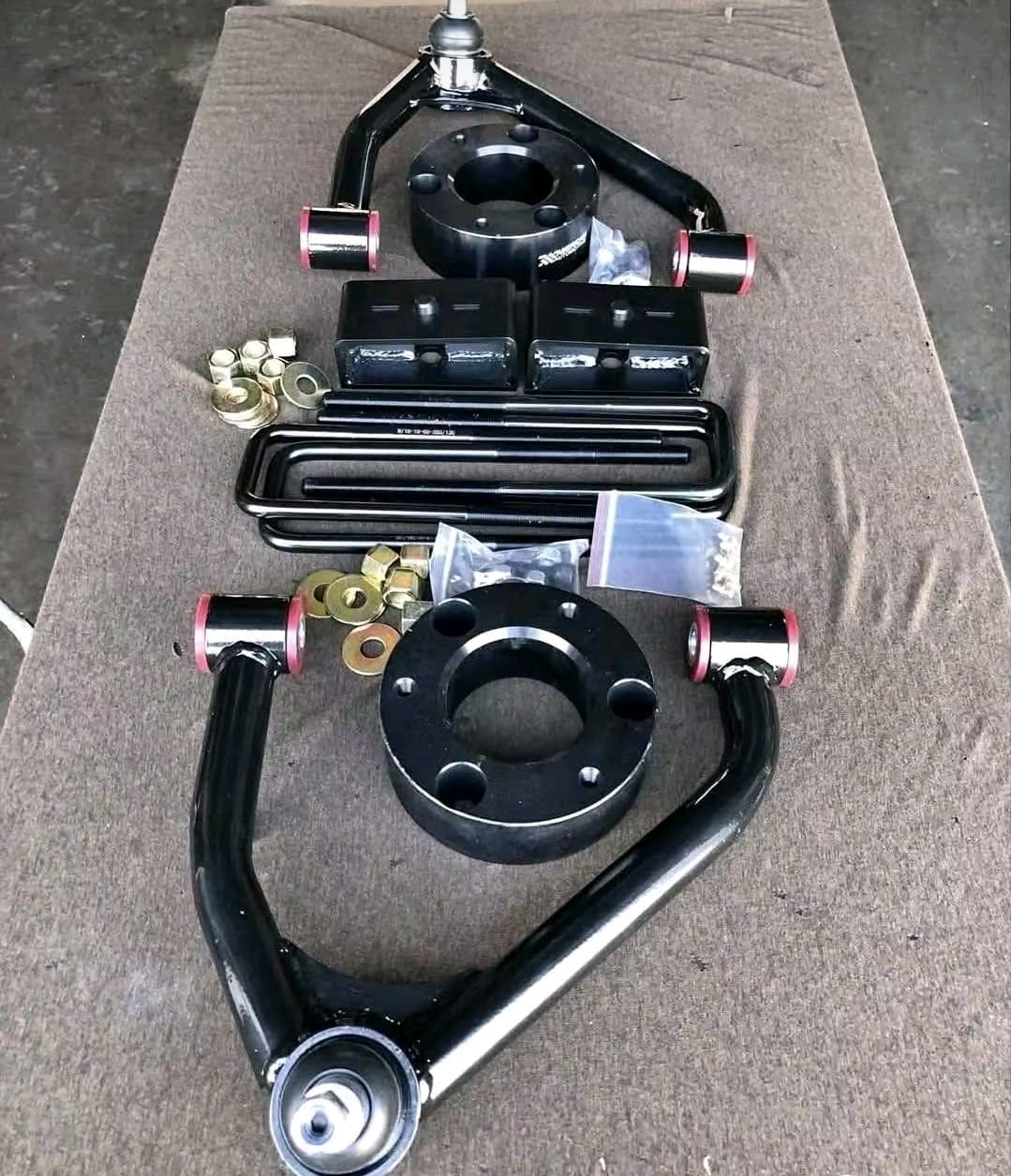 GMC Sierra 1500 suspension lift kit with shocks and front suspension components, GMC Sierra 1500 2 inch suspension leveling lift kit, GMC Sierra 1500 3 inch suspension lift kit with upgraded shocks, GMC Sierra 1500 4 inch suspension lift kit with control arms and shocks, GMC Sierra 1500 6 inch suspension lift kit for off-road applications, GMC Sierra 2500HD heavy duty suspension lift kit with shocks, GMC Sierra 3500HD suspension lift kit with heavy duty components, GMC Sierra suspension lift kit with coilovers and performance shocks, GMC Sierra pickup truck suspension lift kit with front and rear components, GMC Sierra 1500 complete suspension lift kit for larger tires, GMC Sierra 2500HD 6 inch suspension lift kit with upgraded control arms, GMC Sierra off-road suspension lift kit with shocks and springs, GMC Sierra suspension lift kit components displayed for installation, Complete GMC Sierra suspension lift kit with shocks, springs, and control arms, GMC Sierra pickup suspension lift system for increased ground clearance,