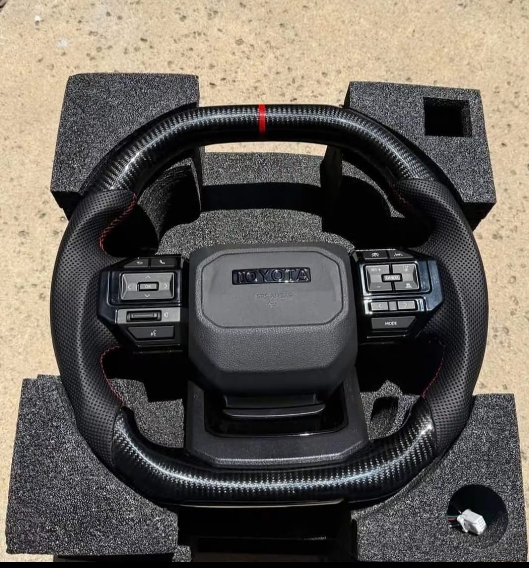 Toyota Tacoma replacement steering wheel for pickup truck, Toyota Tacoma OEM steering wheel assembly, Tacoma leather steering wheel replacement, Toyota Tacoma heated steering wheel, Tacoma multifunction steering wheel with control buttons, Toyota Tacoma urethane steering wheel replacement, Tacoma TRD style steering wheel for truck interior, Toyota Tacoma steering wheel with audio controls, Tacoma steering wheel replacement interior part, Toyota Tacoma steering wheel close up, Tacoma replacement steering wheel assembly, Toyota Tacoma leather wrapped steering wheel, Tacoma heated multifunction steering wheel, Toyota Tacoma steering wheel for interior restoration, Tacoma steering wheel replacement part for sale,