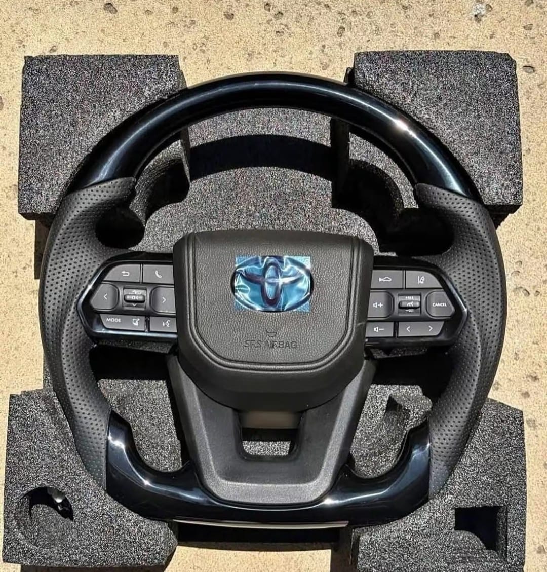 Toyota Tacoma replacement steering wheel for pickup truck, Toyota Tacoma OEM steering wheel assembly, Tacoma leather steering wheel replacement, Toyota Tacoma heated steering wheel, Tacoma multifunction steering wheel with control buttons, Toyota Tacoma urethane steering wheel replacement, Tacoma TRD style steering wheel for truck interior, Toyota Tacoma steering wheel with audio controls, Tacoma steering wheel replacement interior part, Toyota Tacoma steering wheel close up, Tacoma replacement steering wheel assembly, Toyota Tacoma leather wrapped steering wheel, Tacoma heated multifunction steering wheel, Toyota Tacoma steering wheel for interior restoration, Tacoma steering wheel replacement part for sale,